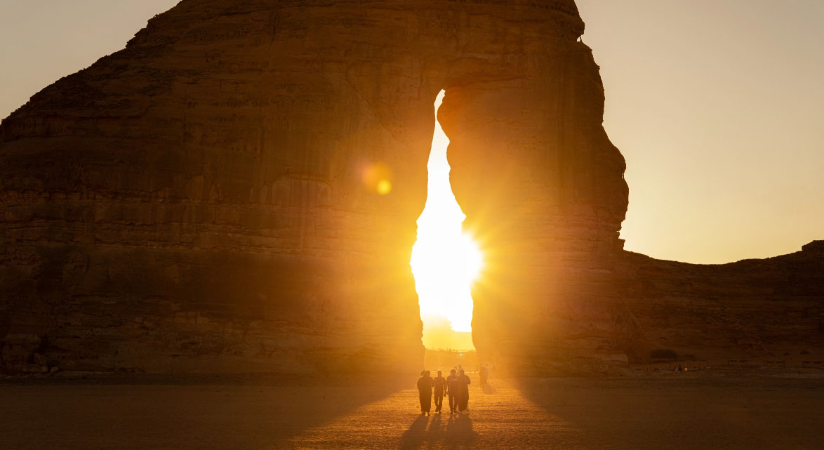 Sun shining through rock formation